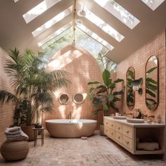 a bath room with a large tub and two sinks under a skylight in it