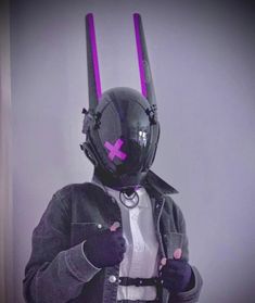 a person in a costume with purple horns on their head and wearing a black jacket