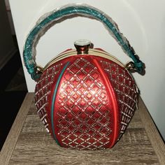 Front Multi Handbag With Lots Of Bling With Green Strap. This Purse Is Beautiful And Comes With A Red Strap And Wallet. The Purse Is 1010 Without Measuring Handles. The Only Thing That Is Wrong Is There Is A Tiny Piece Of "Leather" Missing Near The Bottom. I Have The Picture To Show This. If You Have Any Questions, Please Feel Free To Ask. Red Shoulder Box Bag For Party, Red Handheld Satchel For Party, Handheld Red Satchel For Party, Red Crossbody Clutch For Party, Red Satchel Shoulder Bag For Parties, Red Satchel Evening Bag For Party, Red Pouch Box Bag With Top Handle, Red Pouch Box Bag With Top Carry Handle, Red Clutch Evening Bag With Detachable Handle