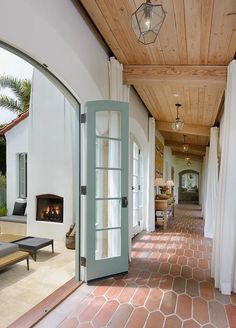 an open door leading to a covered porch