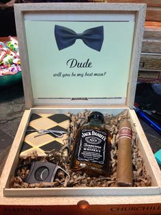 an open box with some liquor and other items inside