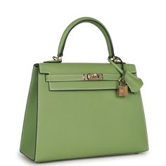 This Special Order Kelly, in the Sellier style, is in Vert Criquet epsom leather with permabrass hardware and has contrast stitching, two straps with front toggle closure, clochette with lock and two keys, single rolled handle and removable shoulder strap.The interior is lined with Vert Criquet chevre and has one zip pocket with an Hermes engraved pull and one open pocket on the opposite side. Collection: B Origin: FranceCondition: New and never worn (plastic on hardware)Accompanied by: Hermes box, Hermes dustbag, clochette, lock, two keys, shoulder strap, carebook dustbag, shoulder strap dustbag, rainhat, carebook and feltMeasurements: 10" width x 7.5" height x 4.5" depth; 2.75" handle drop (16.5" shoulder strap drop) Hermes Kelly Sellier, Kelly Sellier, Hermes Box, Dior Shoes, The Flash, Gold Hardware, Luxury Bags, Versace, Zip Pockets