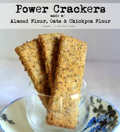 some crackers are in a glass on a blue and white plate with the words power crackers above it