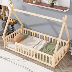 a baby crib in the corner of a room with a white rug and wooden shelves