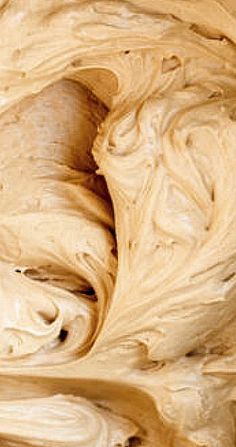 a close up view of the inside of a wooden bowl that has been swirled with brown paint