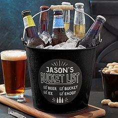 an ice bucket filled with beer bottles next to a bottle opener