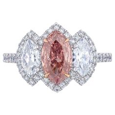 Marquise shaped Diamond weighing 1.01 Carats with GIA certificate stating the diamond is Fancy Deep Orangy Pink. Very unique color. Flanked by Marquise shaped white Diamonds weighing 0.80 Carats of F color and VS Clarity. Set in Platinum. Center prongs are in 18 Karat Rose Gold. Pink Pear Diamond, Dig Jewelry, High Jewelry Design, Glamorous Jewelry, Pink Diamond Ring, Gia Certificate, Marquise Diamond Ring, Marquise Shape Diamond, Genie Bottle