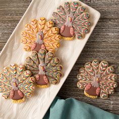 decorated turkey cookies on a white platter