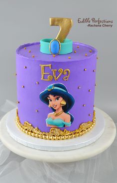 a purple and gold birthday cake with the number seven on it's top tier