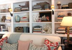 a living room filled with lots of books