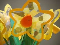 a vase filled with yellow and green flowers