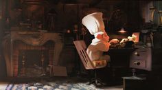 a person in a chef's hat is sitting at a desk with a fireplace