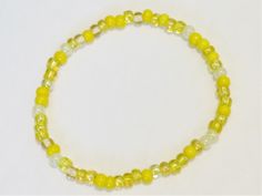 Last one! Colors: Yellow Mix Materials: Seed Beads and Elastic Stretch Cord Shipping: First class within two days of sale, excluding weekends. I can custom make a bracelet to fit using these colors or different colors. No obligation to buy and you always will get to see the pictures of the finished product. Daffodil Yellow, Yellow Bracelet, Sun Yellow, Summer Yellow, Seed Bead Bracelet, Rainbow Bracelet, Cord Bracelet, Pretty Bracelets, Seed Bead Bracelets