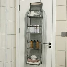 an over the door storage unit in a bathroom