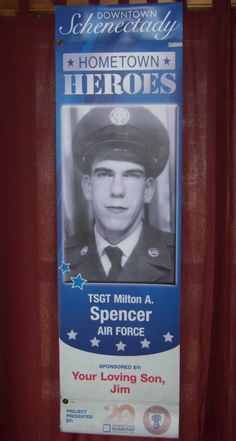 a poster on the side of a building that reads, home town hero spencer air force