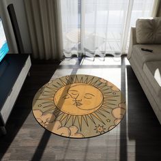 a living room with a sun and moon rug on the floor