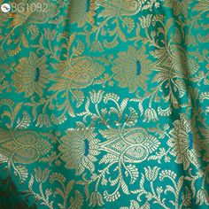 Indian Banarasi Brocade Sea Green and Gold Banarasi Fabric by the Yard brocade bridesmaid lehenga Wedding Dresses Brocade sewing Crafting. This is a beautiful banarasi blended silk brocade fabric in Sea Green and Gold. ➤Product: Brocade Fabric ➤Fabric Type: Blended Silk (Viscose and Silk) Fine quality Zari Brocade Weaving from Banarasi ➤Color: Sea Green and Gold ➤Width: 44 inches. ➤Condition: New  ➤ Code: bg1082 ➤Listing for 1 Yard of fabric. ➤Care: Dry Clean Only You can use this fabric to make Dresses, Tops, Blouses, Jackets, Crafting, Clutches or Evening Bags, Embellish your clothes, Pillows, Drapery, Home Décor, Outdoor, Quilting, Sewing, General, Upholstery etc use it for scrap booking projects. If you purchase more than 1 Yard you will get it in running length, not in pieces. Please