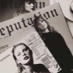 a black and white photo of two women in front of a newspaper