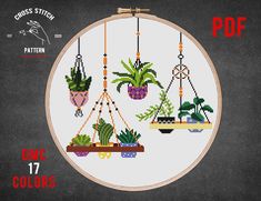 cross stitch pattern with potted plants hanging from hooks