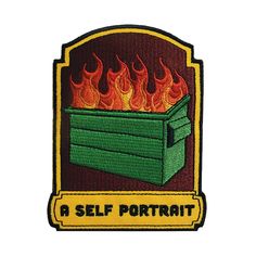 a patch with the words self portrait on it and flames coming out of an open box