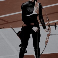 a woman dressed in black holding a bow and arrow