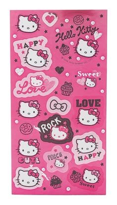 a pink towel with hello kitty stickers on it