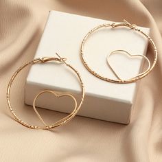 Heart shaped bangle earrings, that are lightweight and easy to wear. They come gold in color with a unique heart embedded in the circle. Bangle Earrings, Tory Burch Earrings, Heart Hoop Earrings, Hollow Heart, Heart Fashion, Alloy Earrings, Gold Diamond Earrings, Skull Earrings, Crystal Stud Earrings