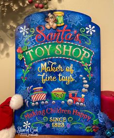 a sign that says santa's toy shop maker of time toys