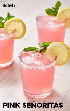 three glasses filled with pink lemonade and mint garnish