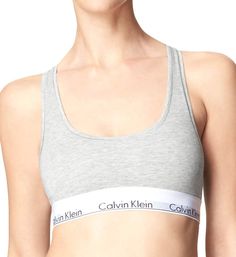 PRICES MAY VARY. LESS IS MORE: Unlined and underwire-free, this Calvin Klein bra combines the label’s famously sporty-sexy look with the feel of a favorite tee. MODERN COTTON: Spun in premium cotton yarns with silky modal and a hint of stretch, CK’s signature bras for women are lightweight, super-soft and breathable. EFFORTLESS: An easy, pullover raceback silhouette makes dressing stress-free. SUPER-SOFT: Smooth and lightweight, this wireless bra for women has an ultra-soft, flexible band that r Calvin Klein Bras, Calvin Klein Bra, Cotton Bralette, Comfy Bra, Soft Bra, Sleeveless Tops, Wireless Bra, Calvin Klein Woman, Bra Lingerie