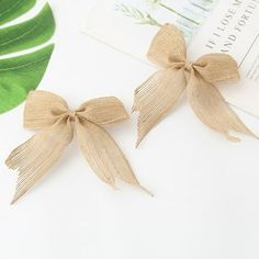 two small bows are sitting on top of a book