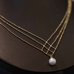 The 18K Gold Plated White Pearl Pendant Necklace for Women is a stunning and elegant piece of jewelry that exudes timeless beauty and sophistication. This necklace features a lustrous white pearl as its focal point, surrounded by a delicate and intricately designed 18K gold-plated pendant setting. This delicate pearl pendant necklace make for an elegant addition to any outfit. Classic jewelry vibe combined with the fashion-forward trend. Comfortable for daily wear, suitable for every occasion. Perfect Gift: This necklace will be a special gift for friends, wife, daughter, mother, sister, perfect gift for Christmas, Graduation, Birthday, Thanksgiving day, Valentine's Day Anniversary, Graduated Day, Mother's day. Material: Brass/18K Gold Plated/Pearl Size：23.0"+2.0"Extension Chain Color: Gol Elegant Gold Round Pearl Necklace, Elegant Gold Plated Round Pearl Necklace, Elegant Pearl Necklace With Delicate Chain, Elegant Gold Pearl Chain Necklace, Elegant Gold-plated Round Pearl Necklace, Elegant Gold Jewelry With Pearl Charm, Gold Akoya Pearl Necklace With Round Pendant, Fine Jewelry Pearl Clavicle Necklace, Elegant Gold Plated Gold Pearl Necklace