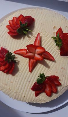 there is a cake with strawberries on it