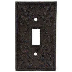 an iron light switch cover with ornate designs on the front and back sides, in dark brown