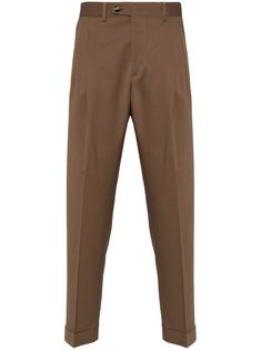 tobacco brown virgin wool blend pressed crease box-pleat detail belt loops mid-rise concealed fly and button fastening straight leg turn-up cuffs two side slash pockets two rear jetted pockets Brown Tapered Leg Business Casual Bottoms, Brown Tapered Leg Bottoms For Business Casual, Tailored Brown Straight Pants, Classic Fitted Pants With Concealed Front Fastening, Classic Business Pants With Concealed Front Fastening, Tailored Brown Pants For Business, Brown Tailored Formal Pants, Fitted Brown Pants With Pressed Crease, Semi-formal Brown Straight Leg Bottoms