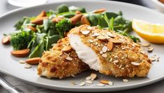 a white plate topped with chicken and greens next to a lemon wedge on top of a bed of broccoli