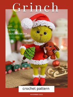 a crochet pattern for a christmas cat holding a teddy bear and wearing a santa hat