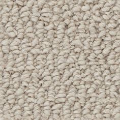 the texture of an upholstered carpet is shown in light beiges and browns