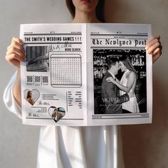 a woman holding up a newspaper with the same photo on it as she holds her wedding date