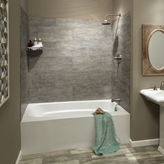 a bathroom with a sink, mirror and bathtub