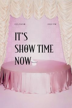 a pink table with the words it's show time now