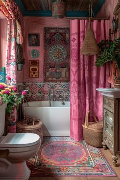 a bathroom with pink curtains and rugs on the floor next to a bathtub