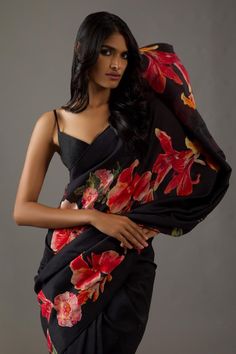 Black silk chanderi saree with all over printed floral motifs. Comes with matching unstitched blouse fabric.
Components: 2
Pattern: Printed
Type Of Work: Floral
Fabric: Silk Chanderi
Color: Black
Other Details: 
Piping on the edges
Note: Stitched blouse worn by the model is not for sale
Occasion: Mehendi and Haldi,Sangeet - Aza Fashions Floral Print Sarees, Floral Saree, Rohit Bal, Black Saree, Indian Fashion Designers, Style And Grace, Printed Sarees, Blouse Fabric, Modern Fashion