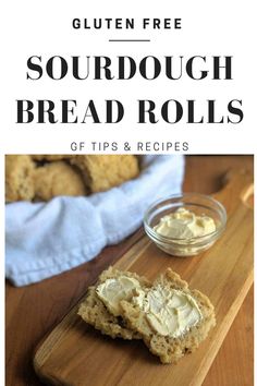 gluten free sourdough bread rolls on a cutting board with butter in the middle