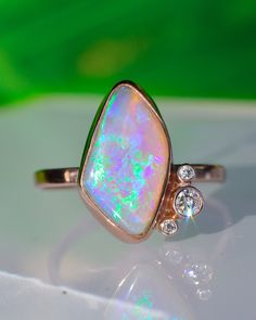 Asymmetrical Lavender/Peach/Dusty Pink Australian Opal with Emerald and Aqua Blue Fire Statement Ring paired with Diamond Accents in Solid 14k Rose Gold. 18mm in length. This gorgeous Opal Statement Ring is made with the dreamy stone I cut the other day in a live! I love how she came out with the stone shape and layout, adorned with sparkling diamonds, in 14 karat rose gold! Handmade with care- I make my Angel Alchemy pieces heirloom quality with solid Australian Opals which I hand cut myself fo Opal Statement Ring, Split Shank Ring, Heirlooms Jewelry, Blue Fire, Australian Opal, Gemstone Healing, Sparkle Diamonds, Statement Ring, Earings Piercings