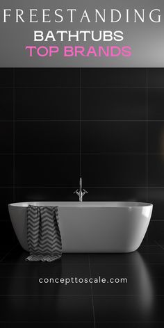 a white bath tub sitting next to a black tiled wall