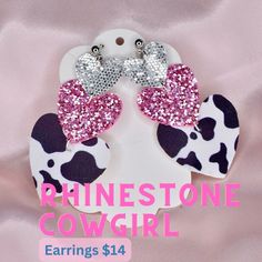 Saddle up your horses ladies and take these earrings for a wild night out on the town!  Cow print pink and silver glitter heart shape drop earrings are made for rhinestone cowgirls of all ages.  The beautiful sparkly earrings are inspired by country divas like Dolly Parton and make perfect accessories for Nashville bachelorette parties, themed parties, Barbie cowgirl costume, and more!  Earrings measure about a 3-inch drop with silver push back stud findings. Cow print earrings are light weight making them ideal for sensitive ears.  Earrings are made from faux leather and glitter canvas with vinyl backing. Ships from Florida in 1-3 days Silver Heart Earrings For Party, Cute Jewelry For Valentine's Day Party, Cute Valentine's Day Party Jewelry, Adjustable Heart Earrings For Party, Pink Heart Earrings For Party, Pink Adjustable Earrings For Valentine's Day, Adjustable Pink Earrings For Valentine's Day, Adjustable Earrings For Valentine's Day Party, Cute Cowgirl Halloween Costumes