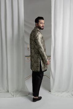 Upgrade your style with our Black and Gold Prince Coat. Made from luxurious brocade material, this front open coat exudes royalty. Paired with an Indian raw silk kurta pajama, it's the perfect ensemble for any formal event. Elevate your look and make a statement with this unique and elegant piece. 3-Piece Suit Raw Silk Kurta, Prince Coat, Open Coat, Silk Kurta, Kurta Pajama, 3 Piece Suits, Raw Silk, Wedding Men, Upgrade Your Style