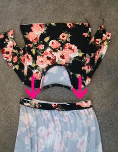 the bottom half of a skirt has been cut out and is shown with pink flowers on it