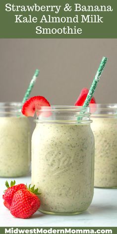 strawberry and banana kale almond milk smoothie in mason jars with strawberries on the side